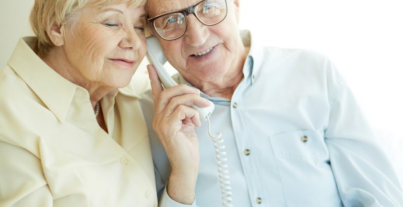 Senior couple talking to a family friend on the phone. Getting back in touch with loved ones can be extremely rewarding