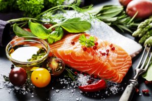Salmon, tomatoes,, olive oil and leafy greens are all examples of inflammation flighting foods.